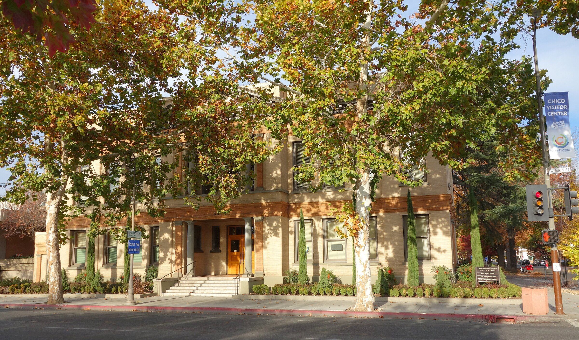 Old Municipal Building beneath leafy trees in downtown Chico, California