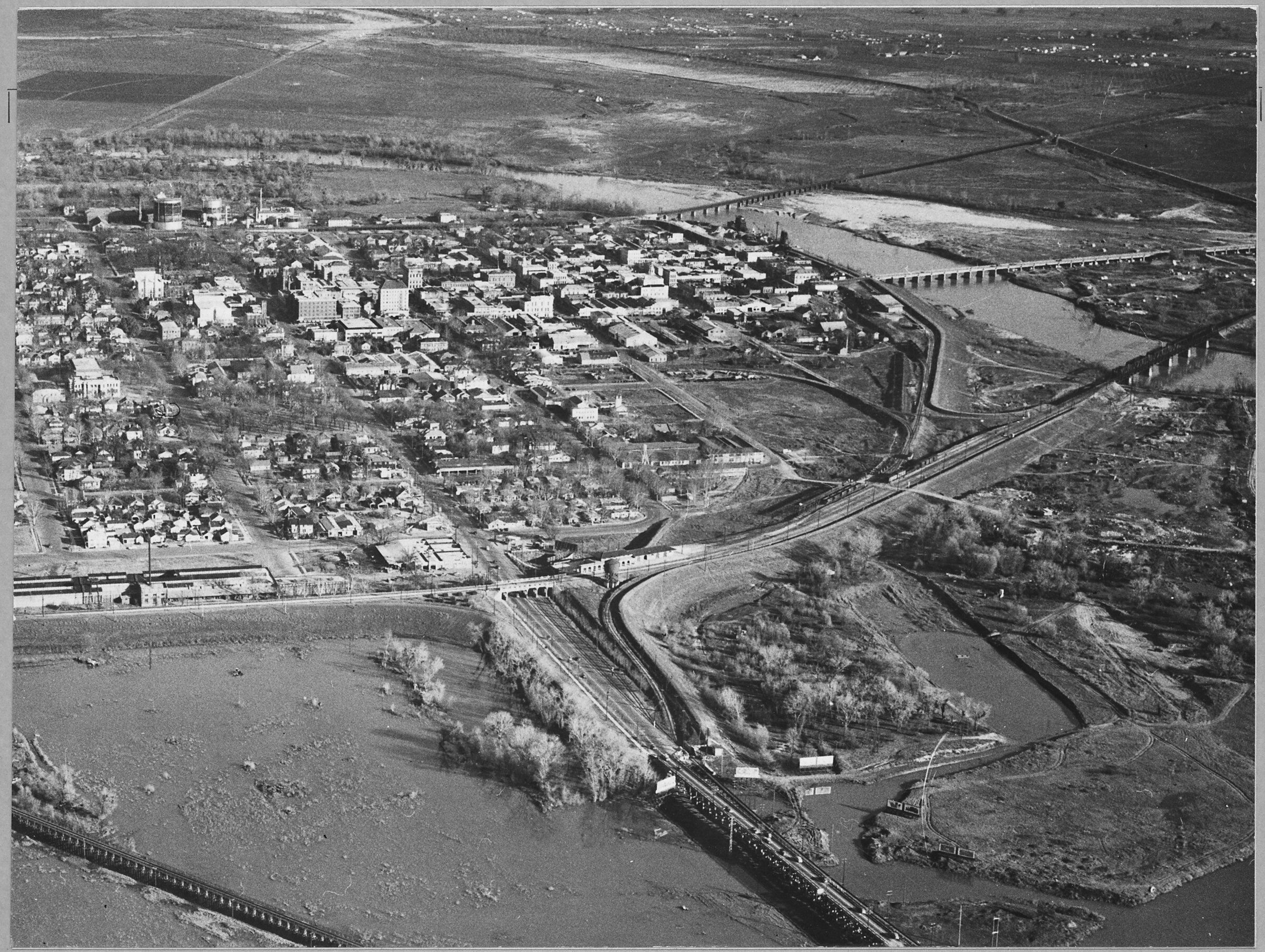 Historic aerial view of Marysville, the Feather River, and rail lines